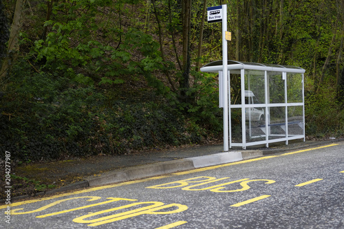 bus stop shelter rural countryside uk public transport free travel pensioner senior person commute photo