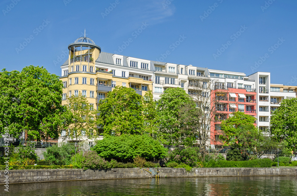  Banks of the river Spree with typical for the district Westphalian quarter buildings in Berlin