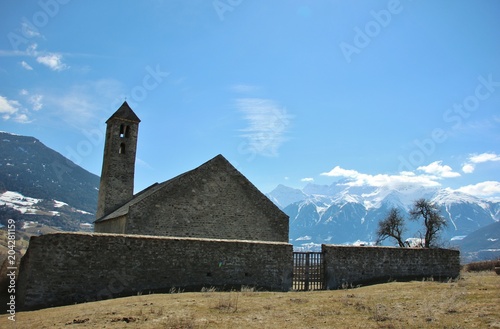 San Vito alpine church in Malles (Tarces hill), Val Venosta, Alto Adige, Italy photo