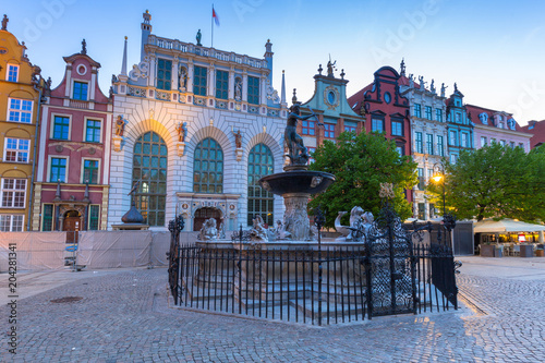 Fountain of the Neptune in old town of Gdansk at dawn, Poland