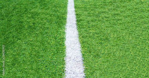Green grass soccer field background, close-up top view