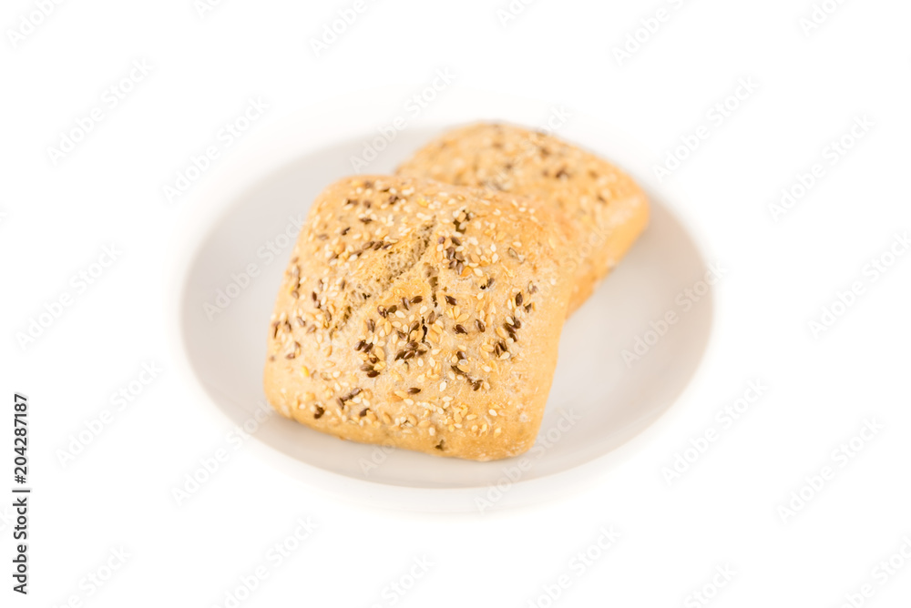 bread with cereals and nuts in a plate on white background bread with cereals and nuts in a plate on white background
