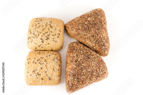 bread with cereals and nuts on white background