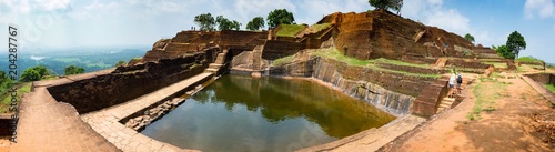 Panorama of a large reservoir of water and a large number of steps in the ancient ruins of the Lion s Rock. Sigiriya  Sri Lanka. high resolution.