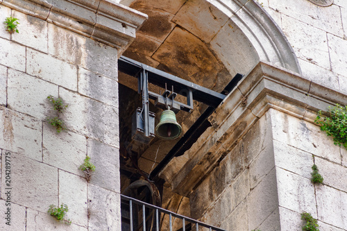 Belfry on the tower of the Catholic Church photo