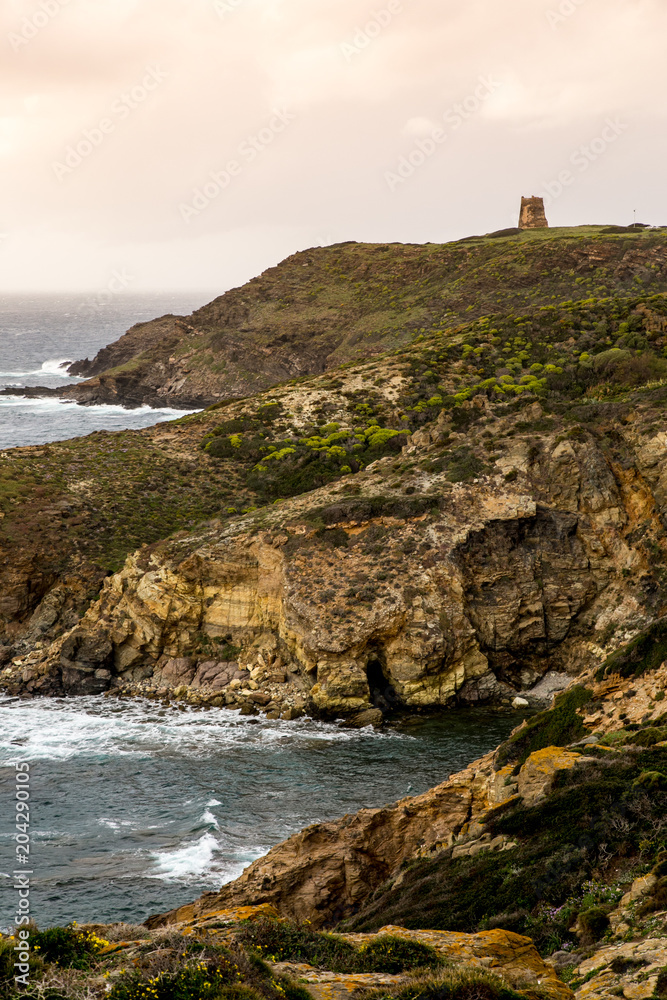 Brick Tower stands on the cliff in Torre dei Corsari
