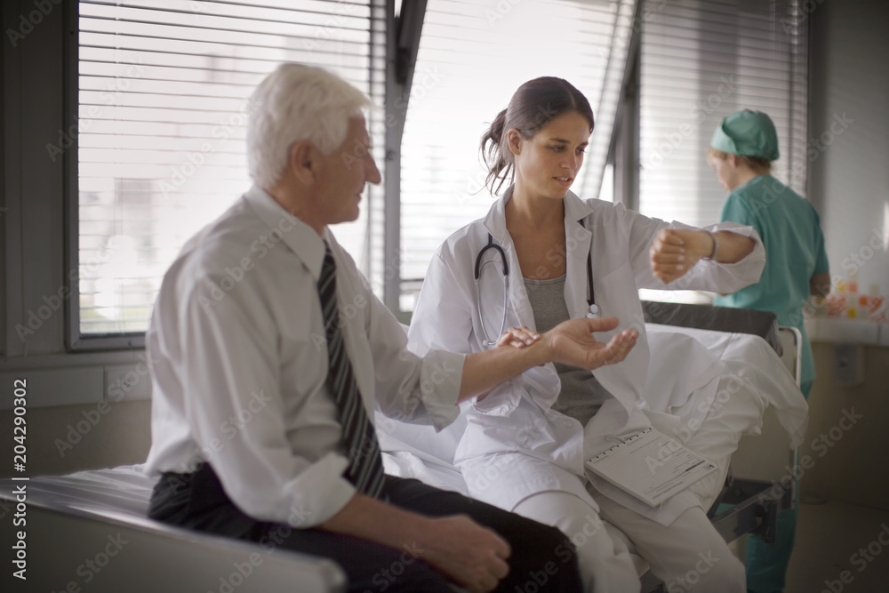 View of a doctor getting himself examined. View of a doctor getting himself examined.