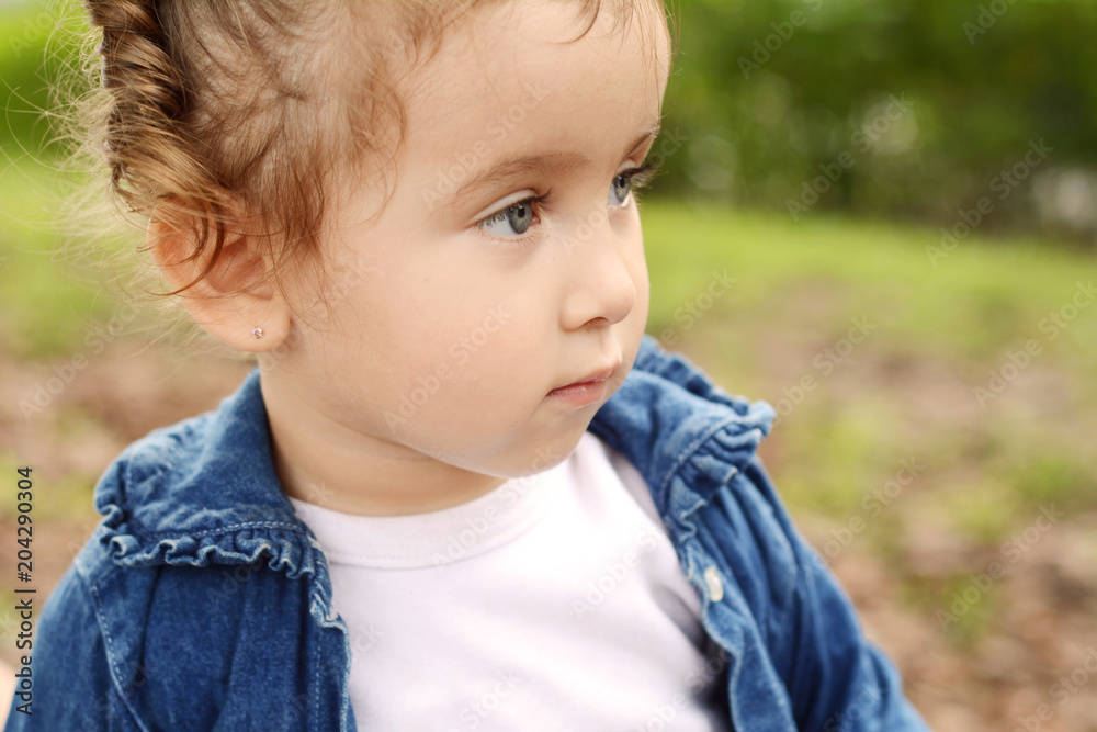 Portrait of baby girl in park.