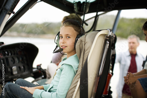 Portrait of a girl sitting in a helicopter.
