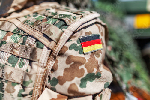 german flag on a german soldier desert uniform photo