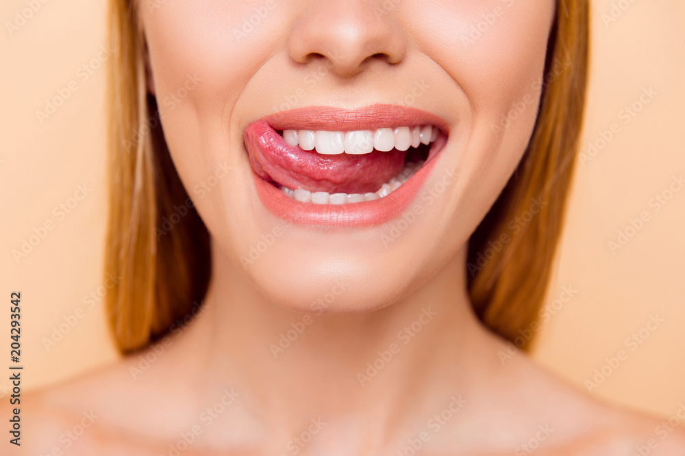 Closeup cropped half face shot of femenine gorgeous playful charming adorable nude natural lady with white healthy teeth gesturing showing tongue out isolated on beige background, correction concept Closeup cropped half face shot of femenine gorgeous playful charming adorable nude natural lady with white healthy teeth gesturing showing tongue out isolated on beige background, correction concept