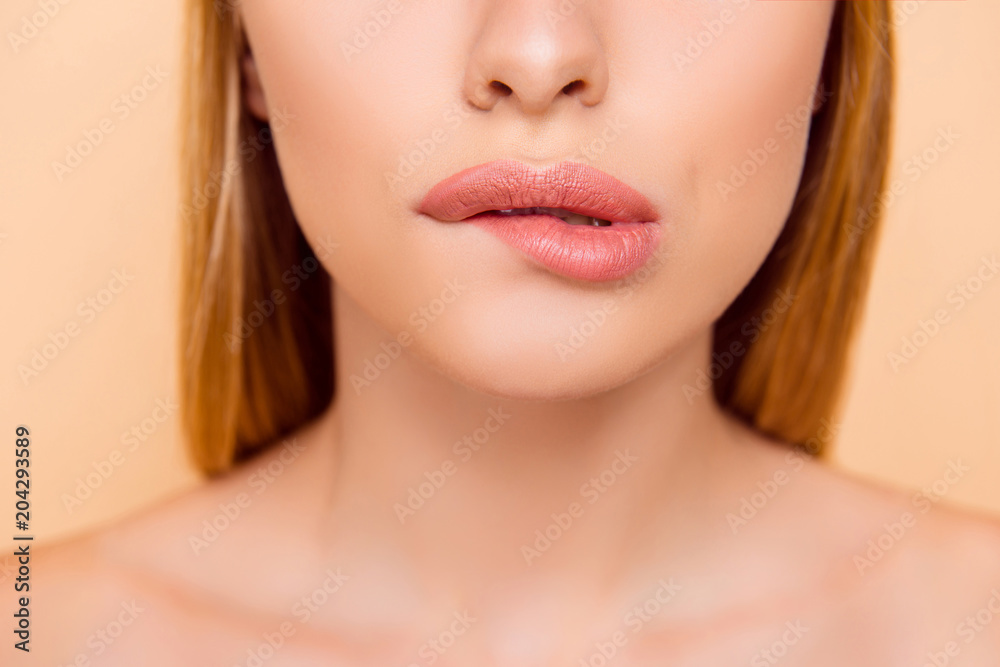 Closeup cropped half face shot of femenine sensual playful charming adorable nude natural lady biting low lip isolated on beige background, temptation, seduction, feelings concept Closeup cropped half face shot of femenine sensual playful charming adorable nude natural lady biting low lip isolated on beige background, temptation, seduction, feelings concept
