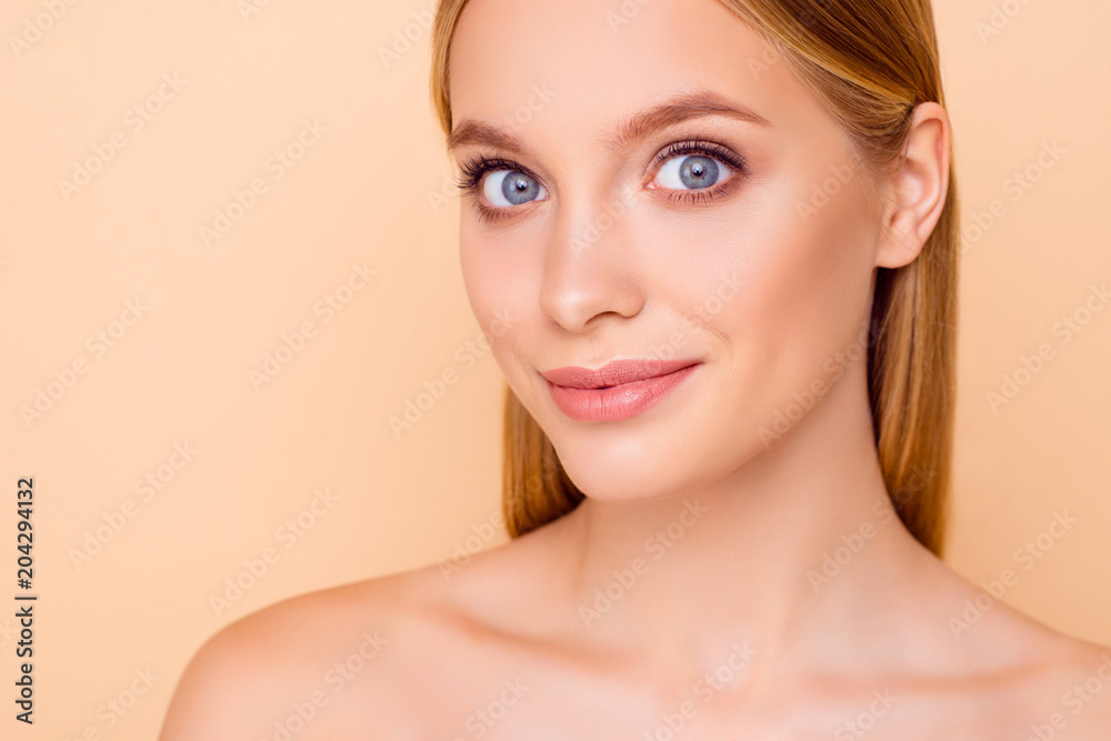 Close up horizontal portrait of pretty charming cute stylish trendy sensual lovely shine girl with big eyes plump lips, isolated on beige background, effect after mask, peeling, cream, lotion, scrub