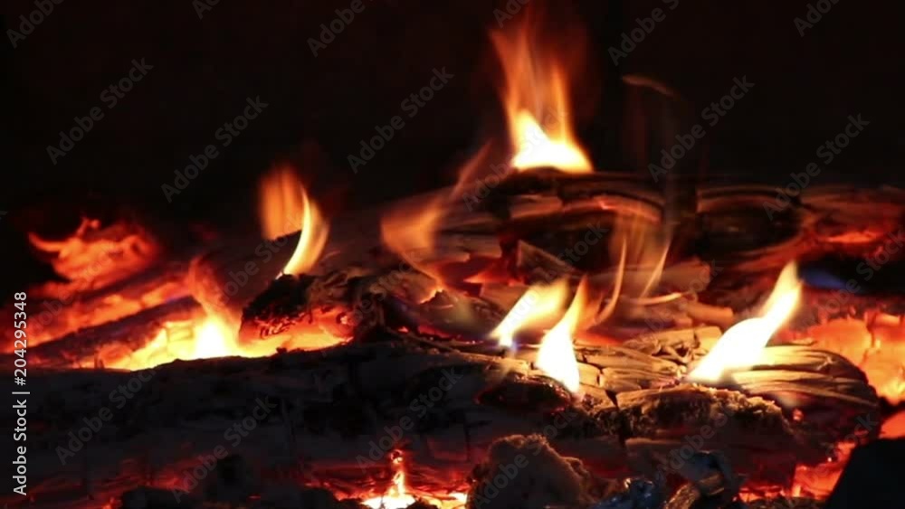Hot coals and fire flames in fireplace, bonfire close-up. Hot coals and fire flames in fireplace, bonfire close-up.