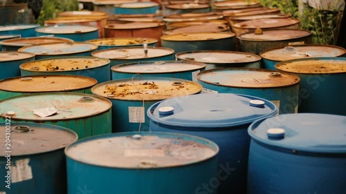 Old rusty barrels with oil products casks