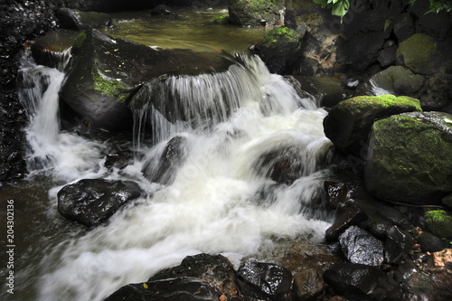 A small cascade flows below Hidden Waterfall at Viento Fresco in Costa Rica