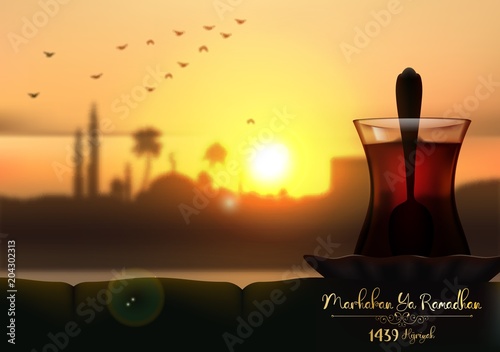 Marhaban ya Ramadhan. A cup of tea in beautiful sunset background