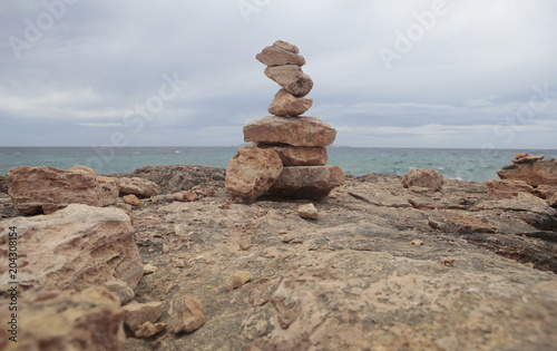 Stone balancing in the south coast of the Spanish island of Mallorca.