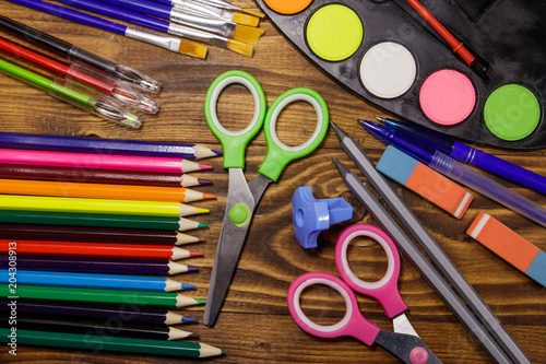 Set of school stationery supplies on wooden desk