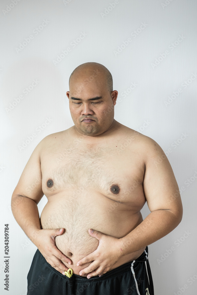Naklejka premium Fat man ,overweight man with big belly on white background in studio.