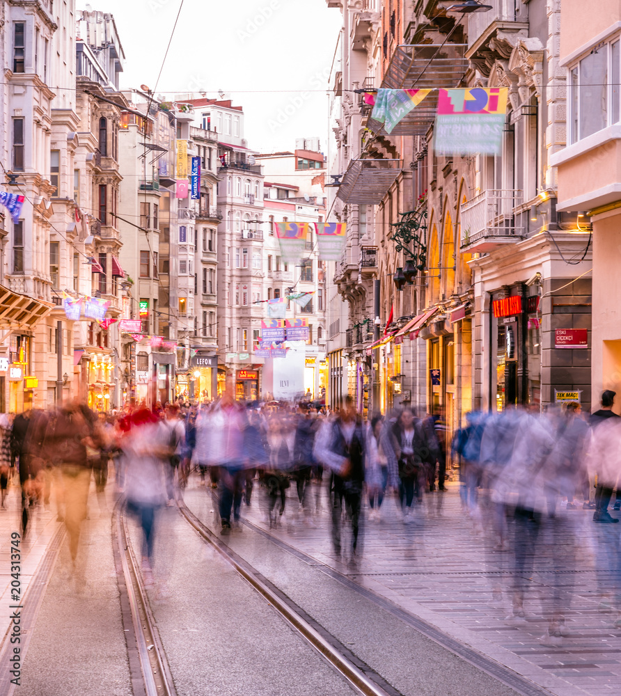 People walk at Istiklal street in Istanbul