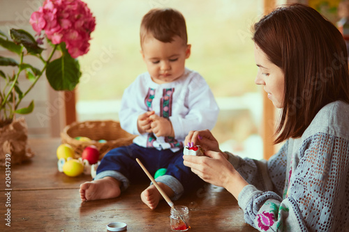 The mother and son painting Easter eggs