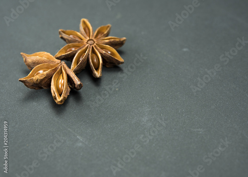 anise two stars on a black background. Oriental spices, macro photography, ingredients