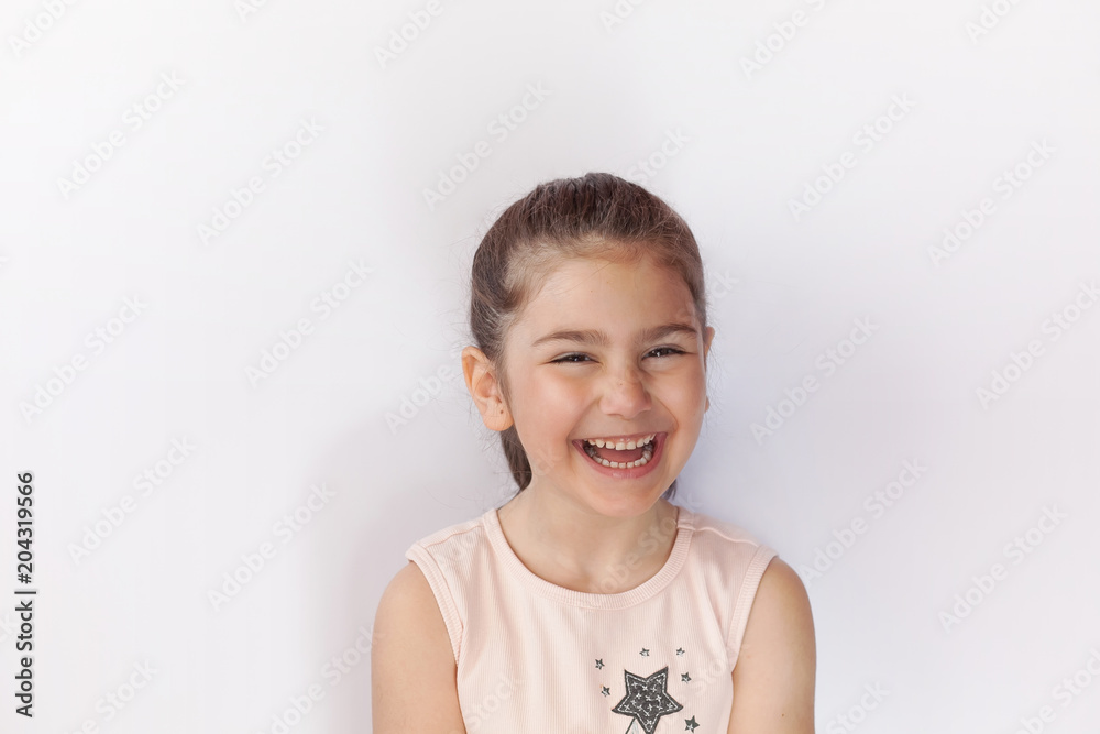 Portrait of a happy smiling child girl. True emotions. Space for text. Portrait of a happy smiling child girl. True emotions. Space for text.