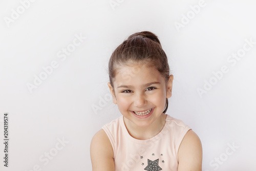 Portrait of a happy smiling child girl. True emotions. Space for text.
