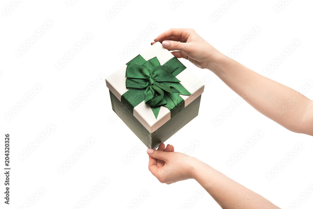 Woman hands holds present gift box Woman hands holds present gift box