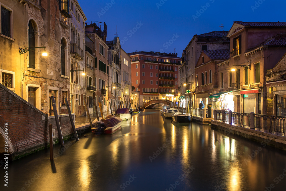 Canal at night in Venice, Italy.