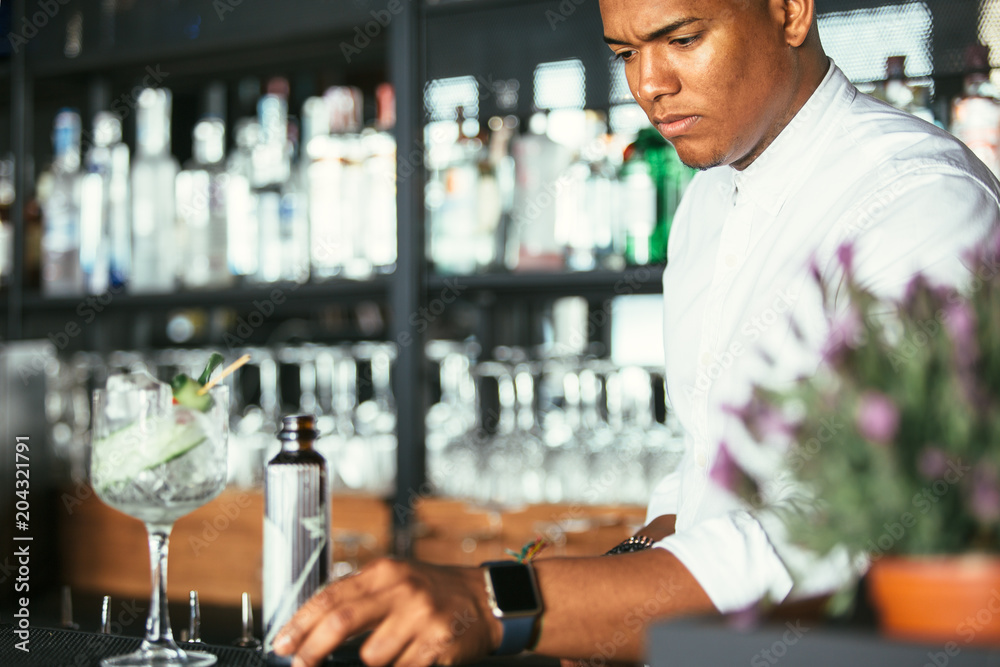 Expert male bartender with cocktail Expert male bartender with cocktail
