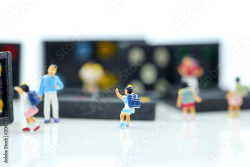 Miniature people : children and student with Domino ,Playing and learn education concept.