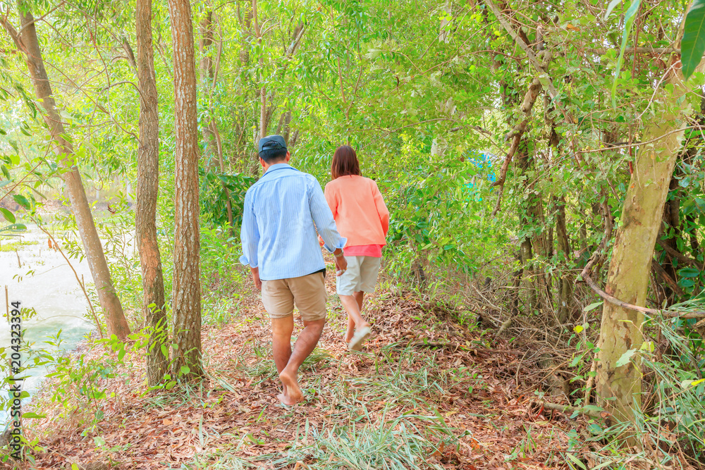 Man and woman movement walking in the forest Man and woman movement walking in the forest