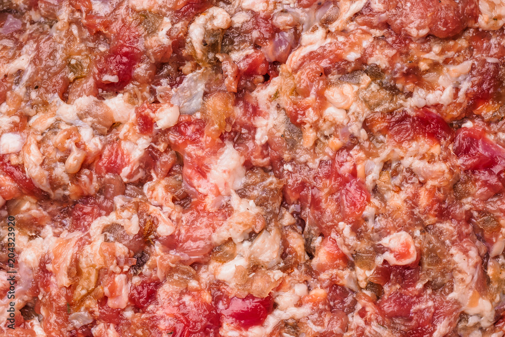 Fresh homemade raw chopped beef and pork meat. Minced meat texture, close up background - top view. Fresh homemade raw chopped beef and pork meat. Minced meat texture, close up background - top view.