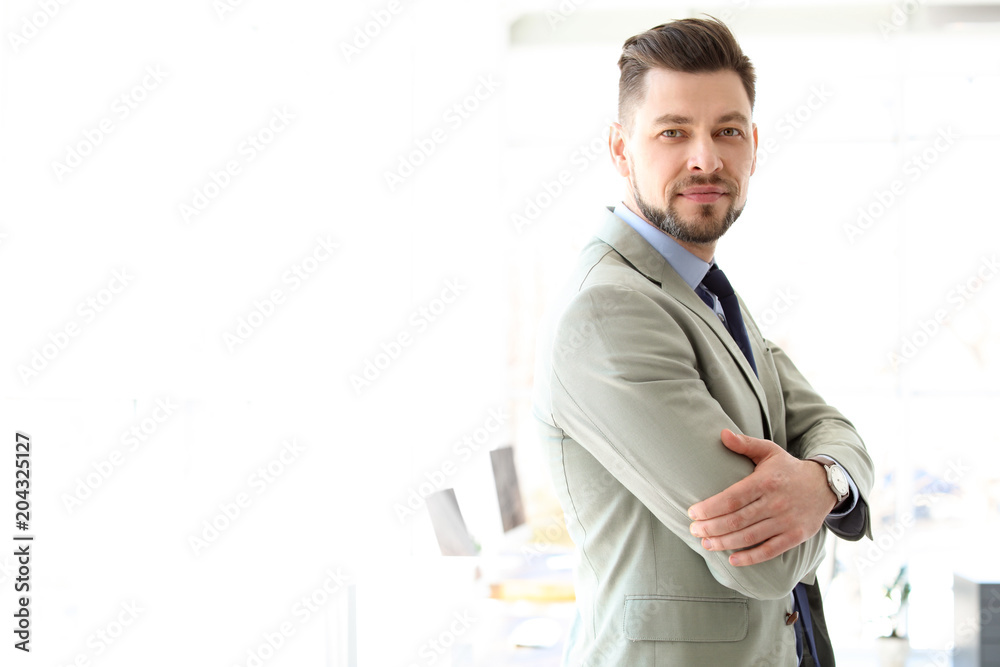Fototapeta premium Male lawyer standing in light office