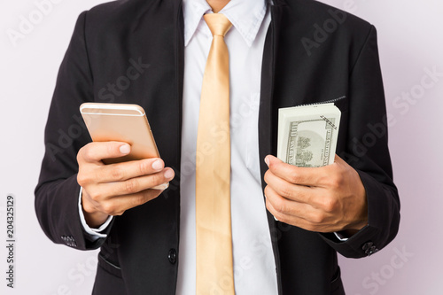 Businessman use his smartphone for his business . Business concept