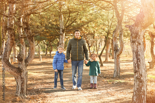 Father and little kids outd...