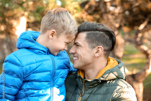 Young man and little boy ou...