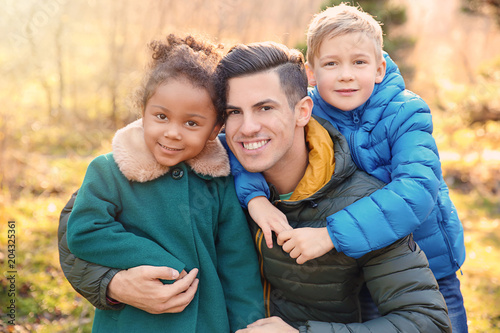 Father and little kids outd...