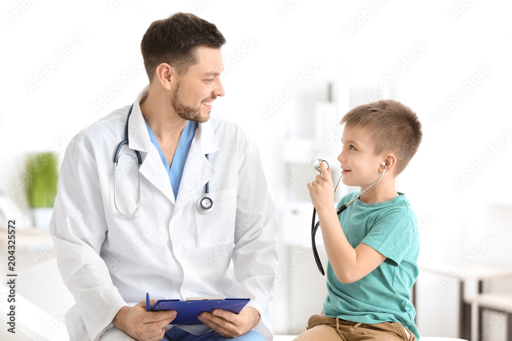 Children's doctor with little boy in hospital Children's doctor with little boy in hospital