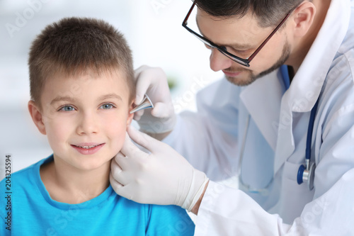 Children's doctor examining...