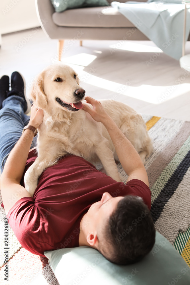Obraz premium Portrait of owner with his friendly dog at home