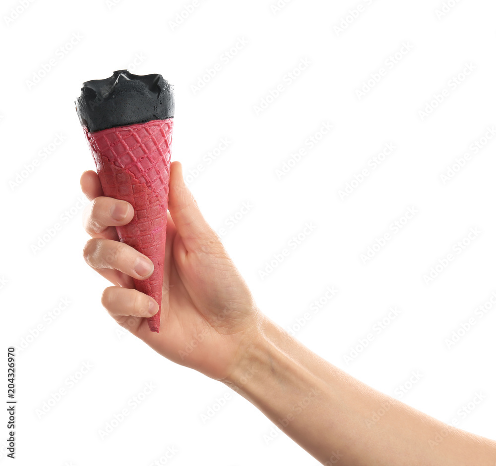 Fototapeta premium Woman holding yummy ice cream on white background. Focus on hand