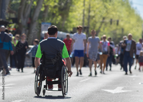 Man in wheelchair on marathon