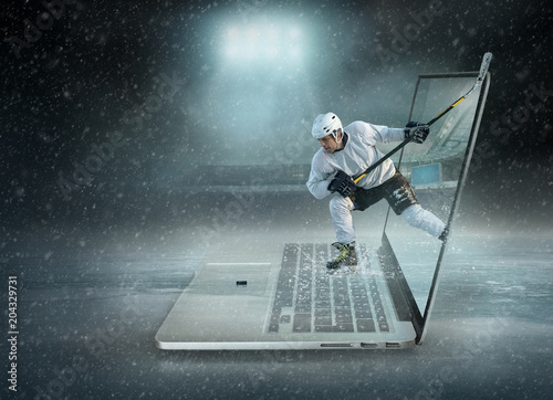 Photography Caucassian ice hockey Players in dynamic action in a professional sport game play on the laptop in hockey under stadium lights