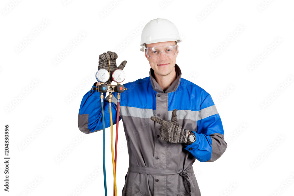 Builder, installer of ventilation with tools in hands Builder, installer of ventilation with tools in hands