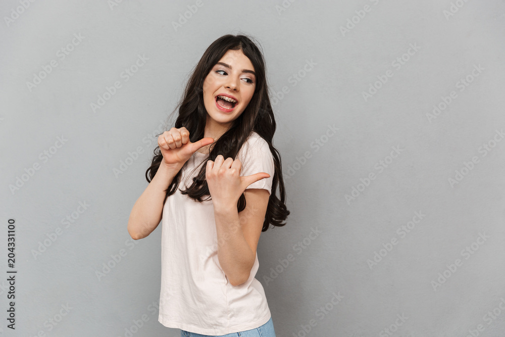Beautiful young lady pointing. Beautiful young lady pointing.