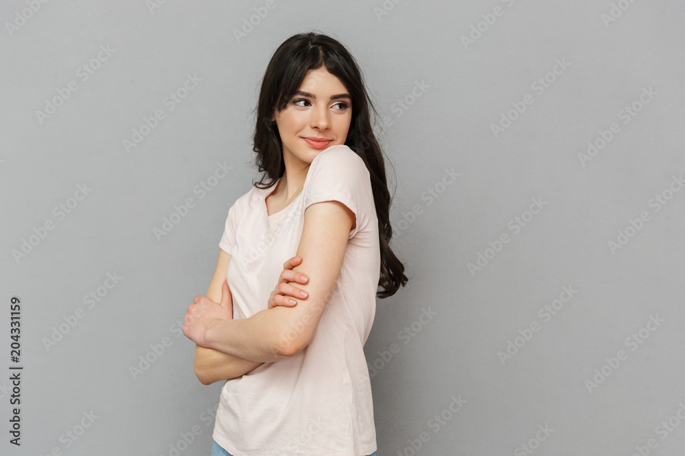 Cheerful beautiful young lady standing isolated Cheerful beautiful young lady standing isolated