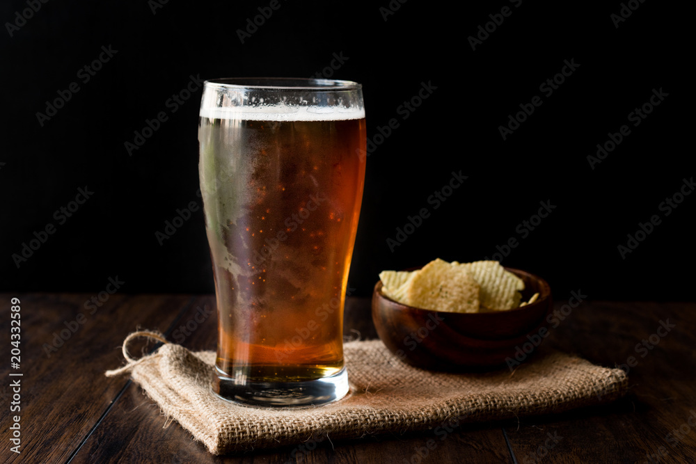 Cool Refreshing Amber Beer with Snacks. Cool Refreshing Amber Beer with Snacks.